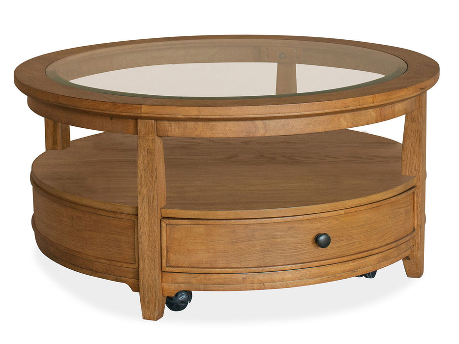 Durant - Round Cocktail Table With Casters - Honey Brown